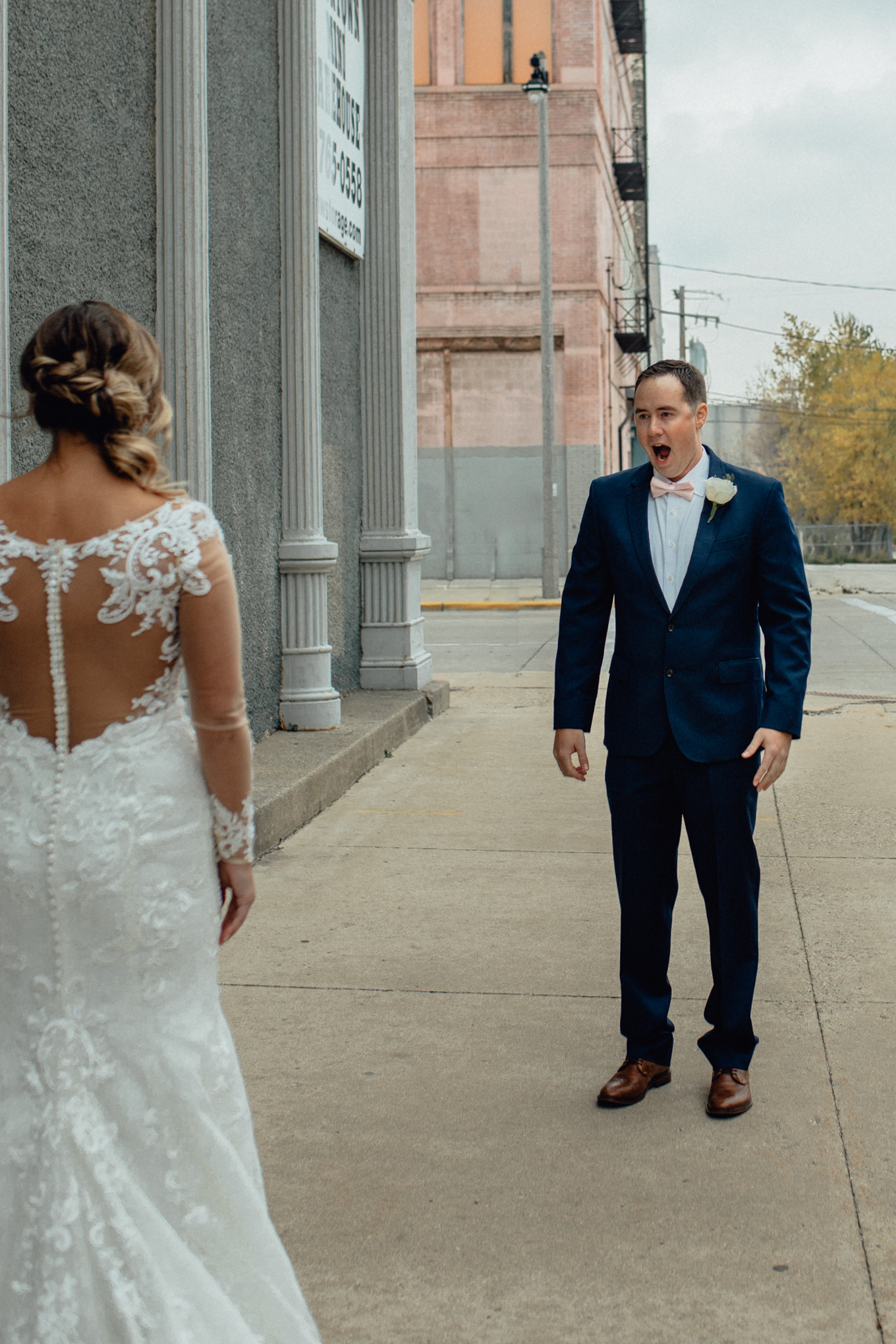 man and women on street sharing first look before wedding