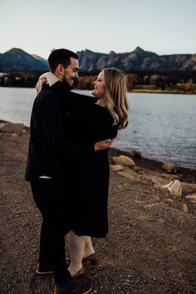 couple dancing at lake estes for engagement session
